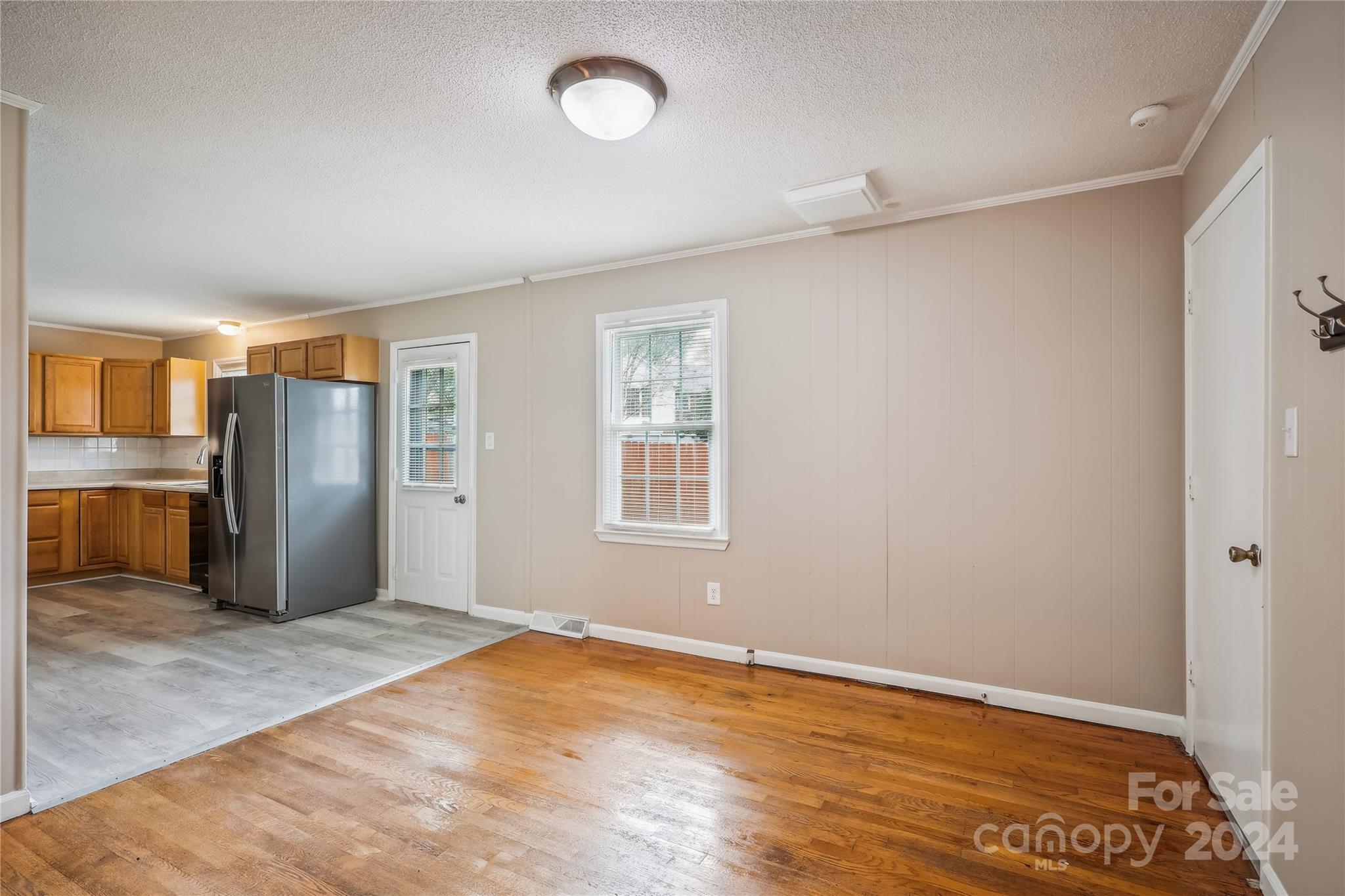 335 Pine Valley Road Salisbury, NC 28147 - Photo 7 of 31 an empty room with wooden floor and a window