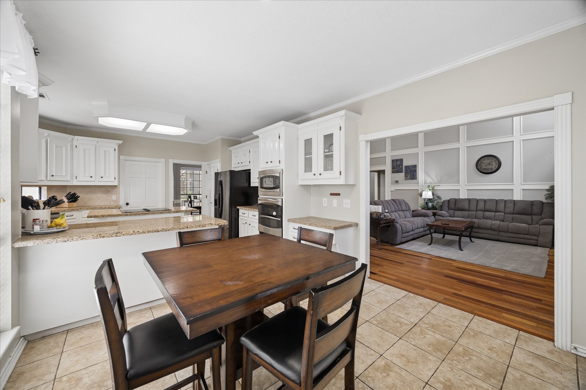 5823 Ashmere Lane Spring, TX 77379 - Photo 12 of 29 a view of a dining room with furniture and wooden floor
