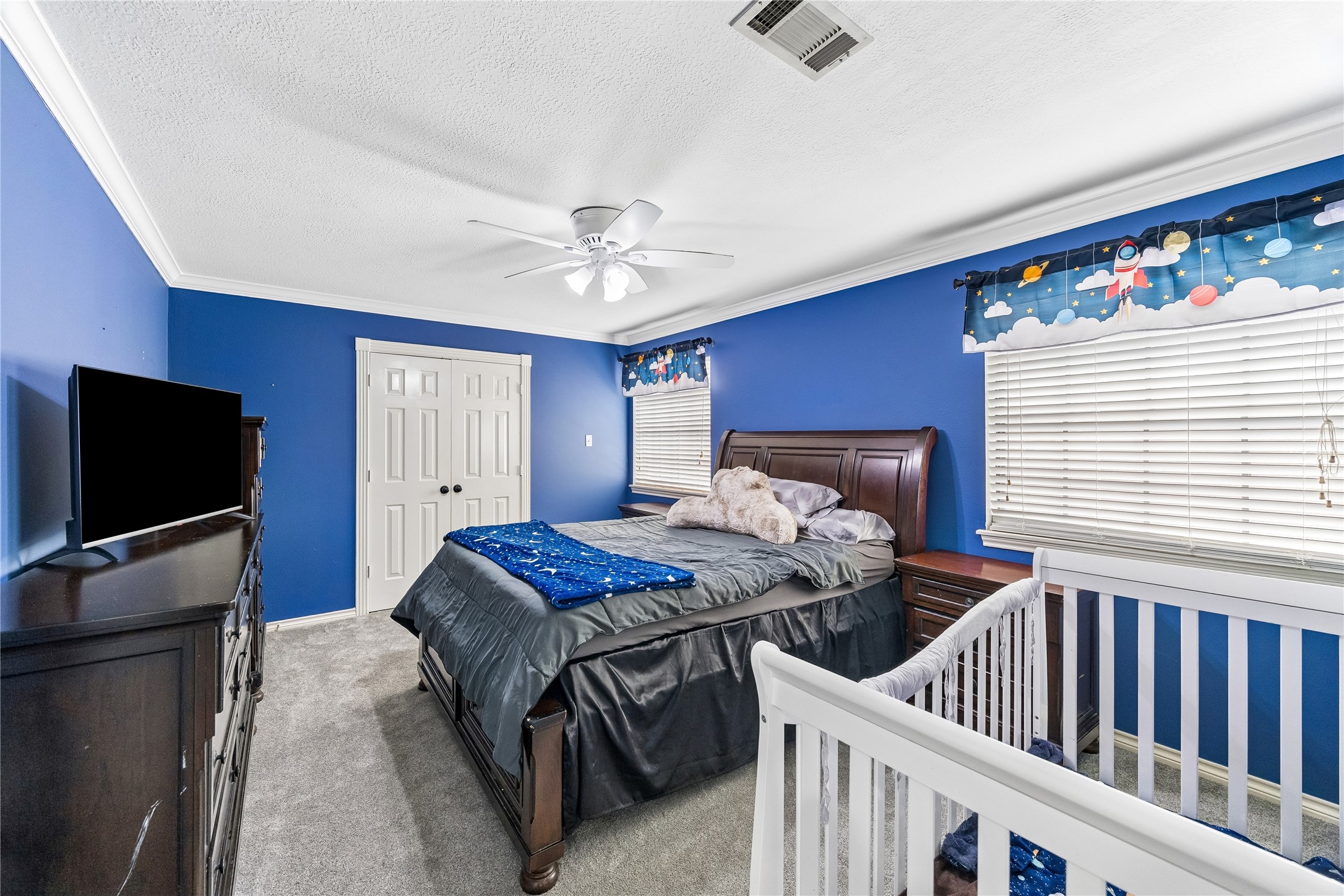 5823 Ashmere Lane Spring, TX 77379 - Photo 15 of 29 a bedroom with furniture and a flat screen tv