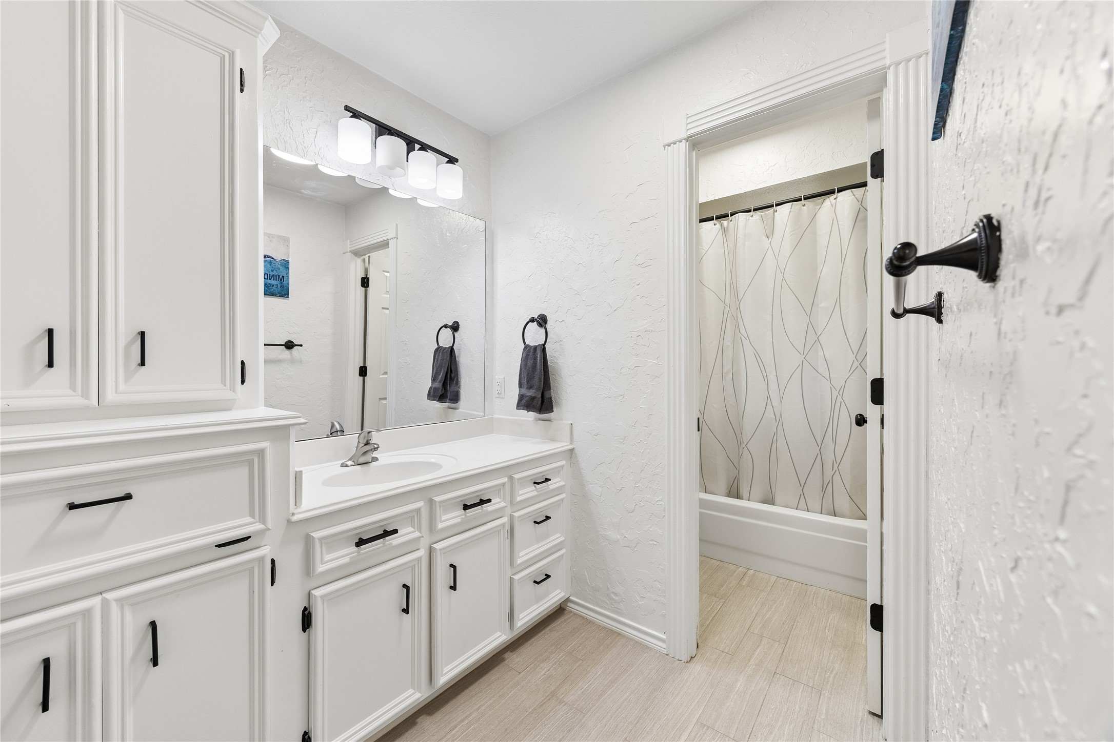 5823 Ashmere Lane Spring, TX 77379 - Photo 16 of 29 a spacious bathroom with a granite countertop sink mirror and double