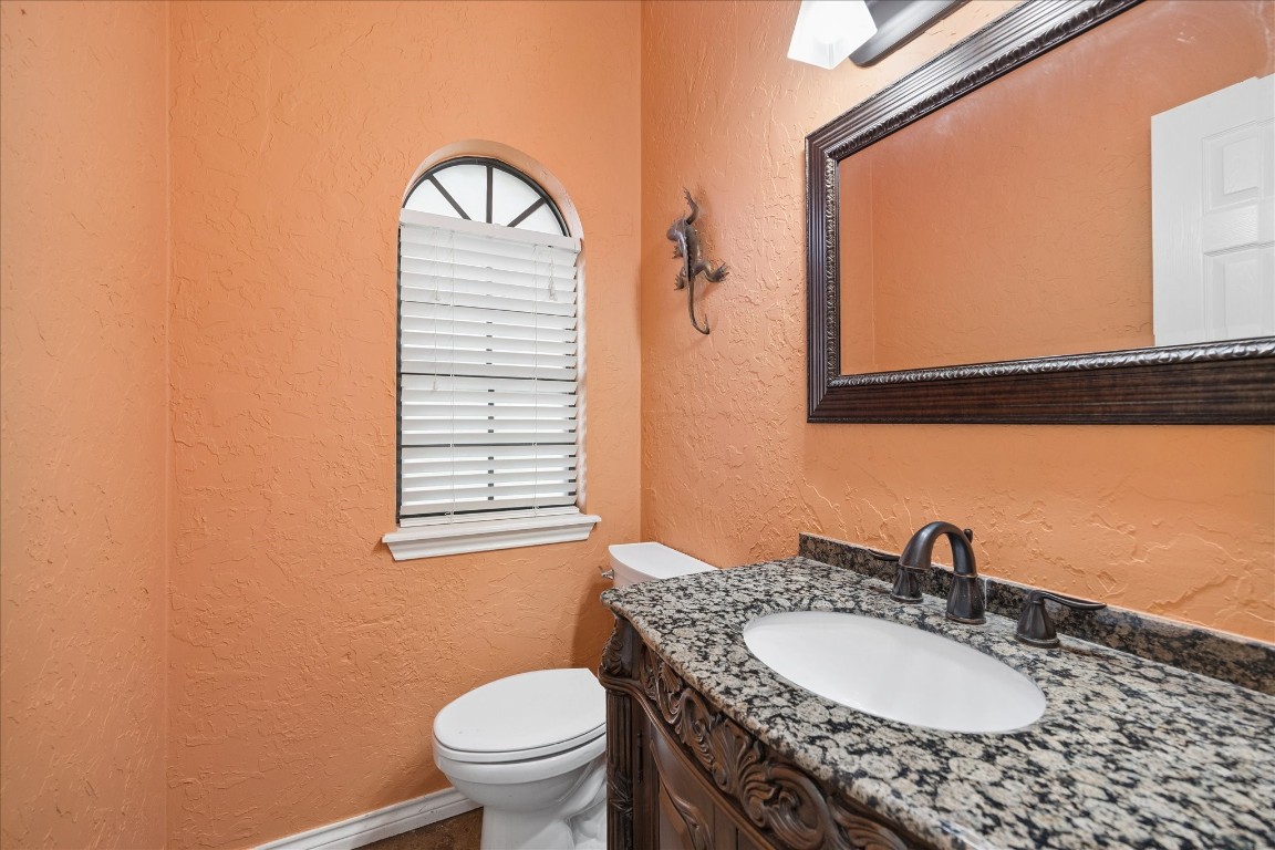 5823 Ashmere Lane Spring, TX 77379 - Photo 17 of 29 a bathroom with a granite countertop sink and a mirror