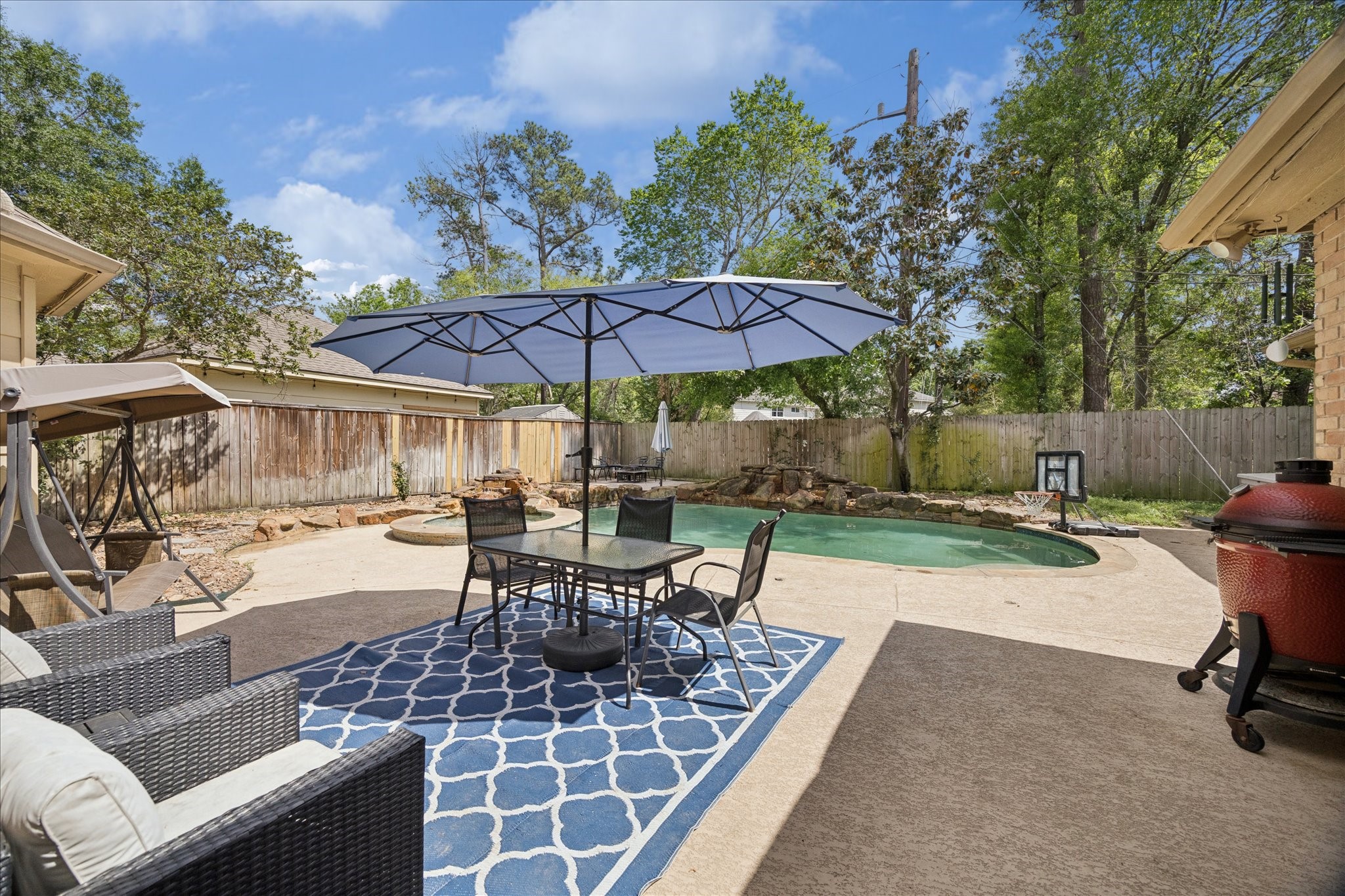 5823 Ashmere Lane Spring, TX 77379 - Photo 24 of 29 a view of a backyard with sitting area and furniture