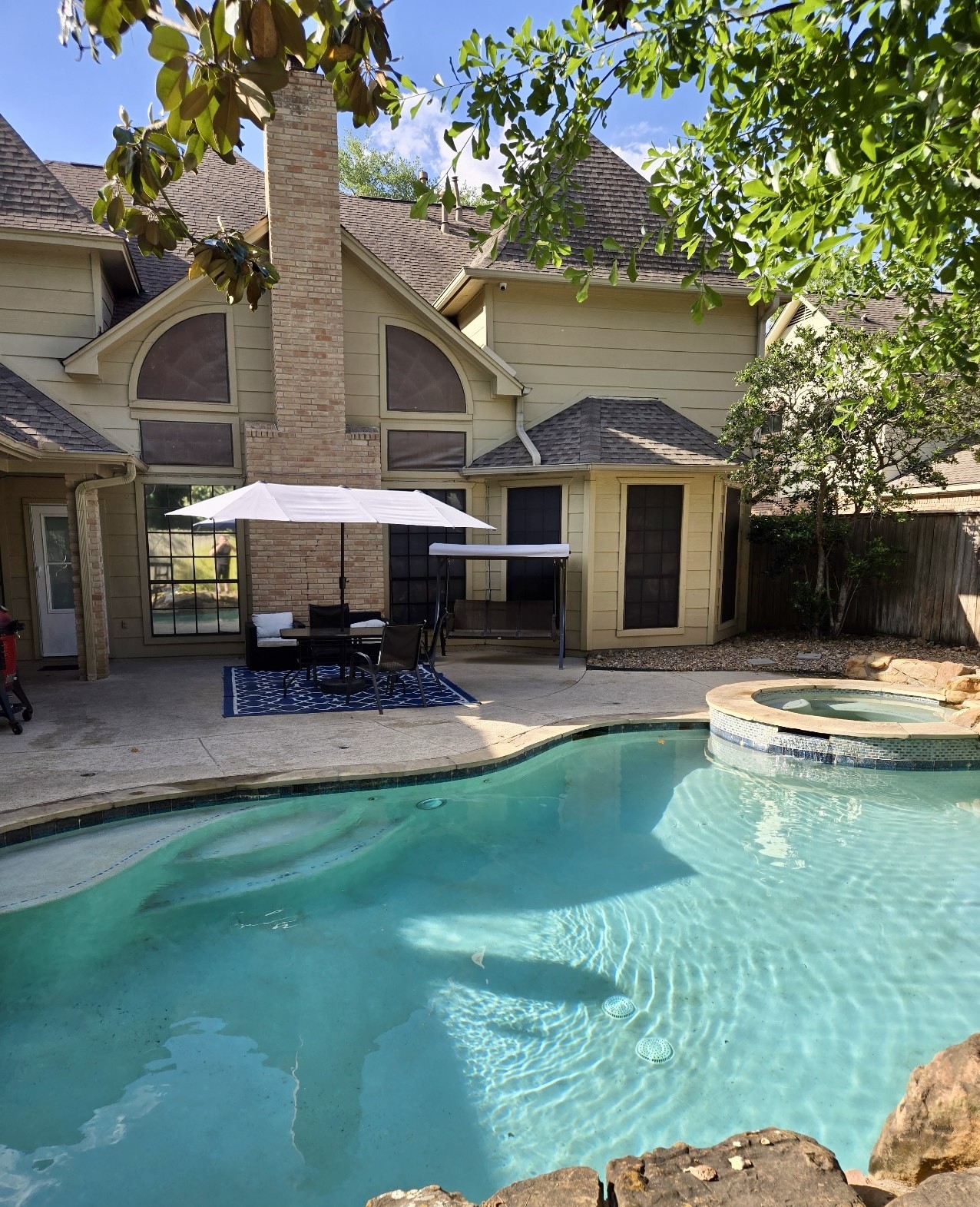 5823 Ashmere Lane Spring, TX 77379 - Photo 5 of 29 a view of a house with swimming pool and sitting area