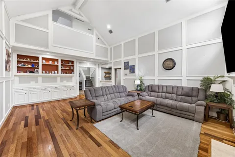 a view of living room with furniture and fireplace