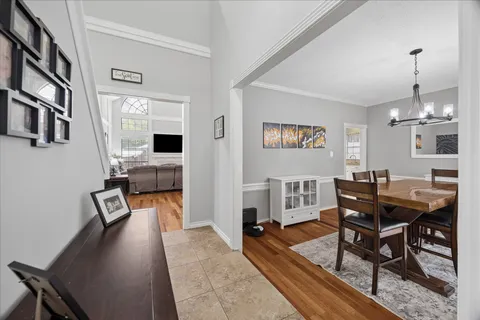 a kitchen with stainless steel appliances granite countertop a sink and a refrigerator