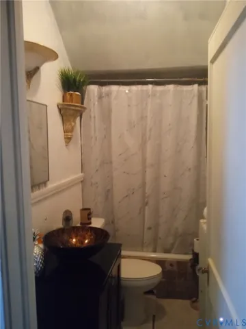 a bathroom with a sink and toilet