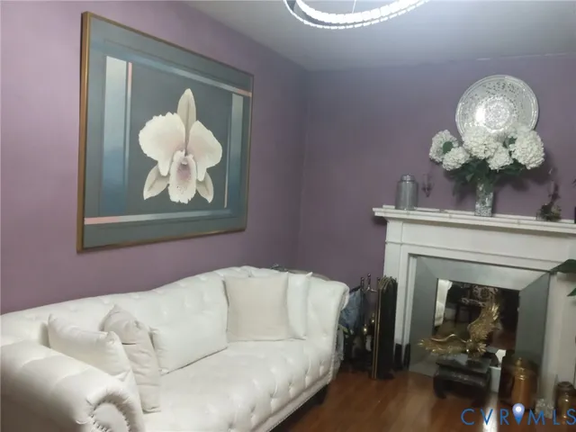 a living room with a couch and a fireplace