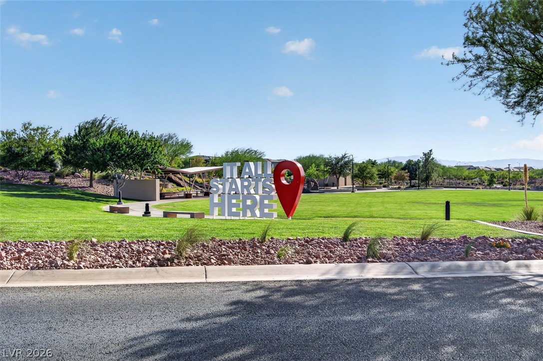 1100 East Sunset Road Henderson, NV 89011 - Photo 52 of 58 A vibrant green park welcomes residents with a large landmark sign and mature landscaping.