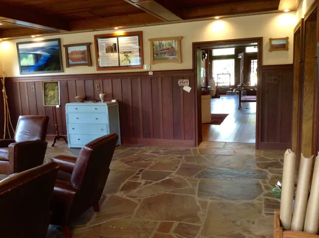 a view of a hallway with seating space