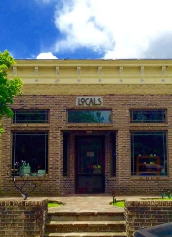 a view of a fireplace with a fireplace in front of it