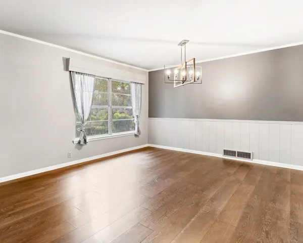 a view of kitchen with wooden floor and window