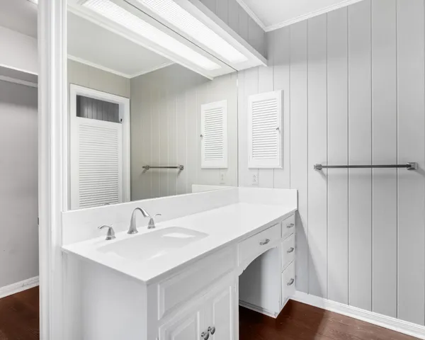 a bathroom with a shower and a sink