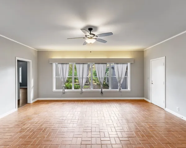 a view of an empty room with a window