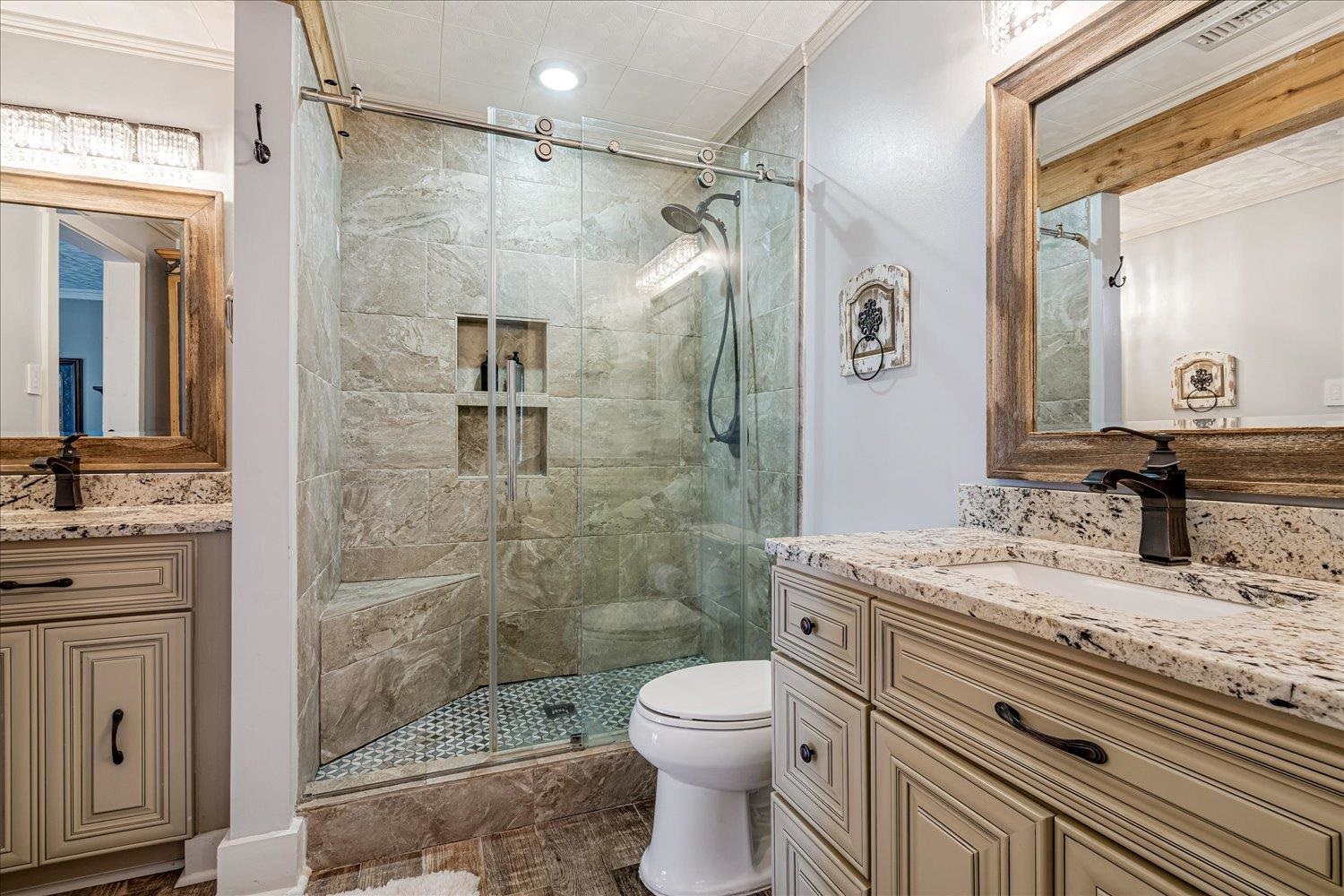 9516 El Hill Road Lakeland, TN 38002 - Photo 12 of 25 a bathroom with a granite countertop sink toilet and shower