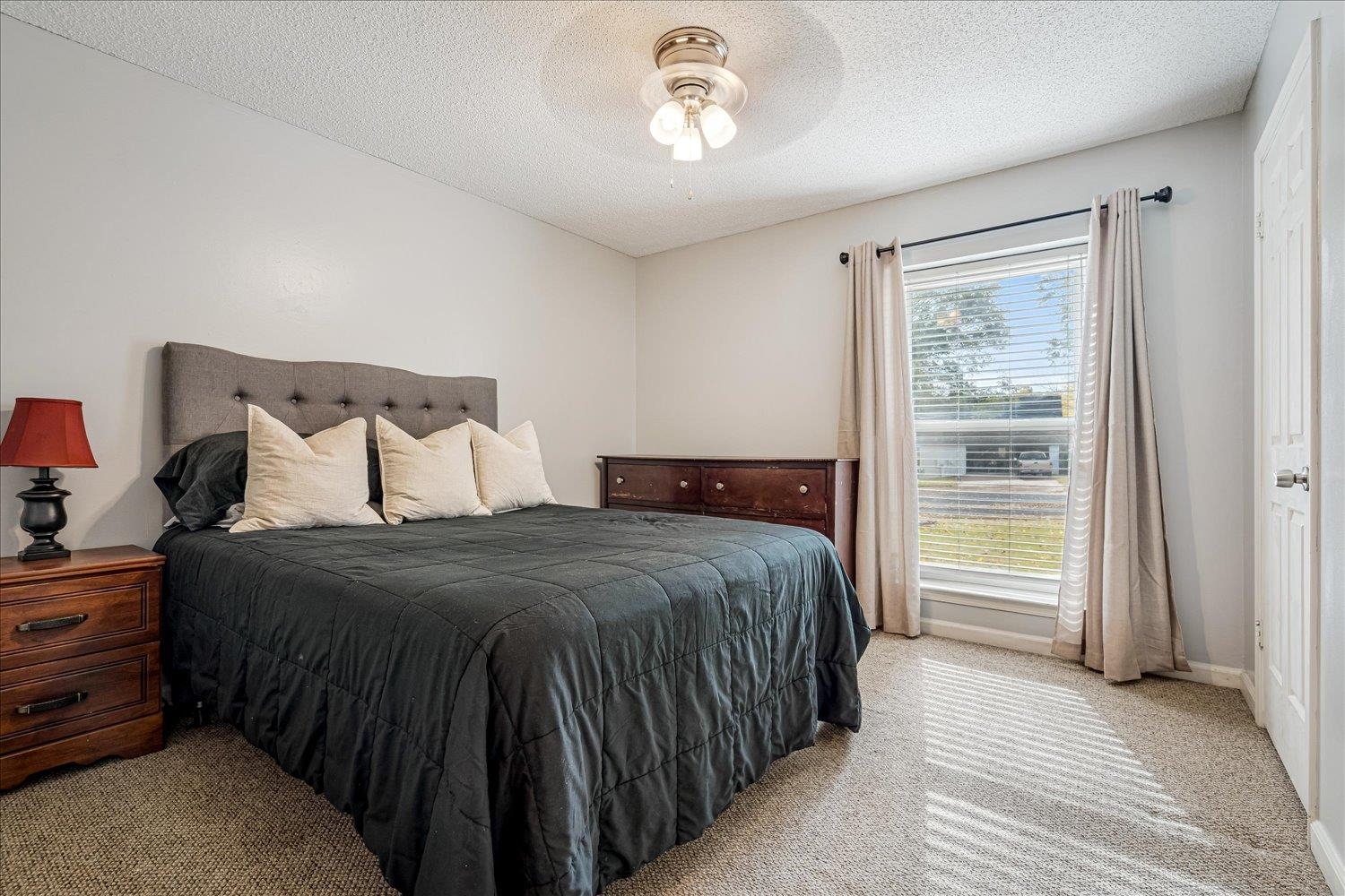 9516 El Hill Road Lakeland, TN 38002 - Photo 17 of 25 a bedroom with a bed and a window