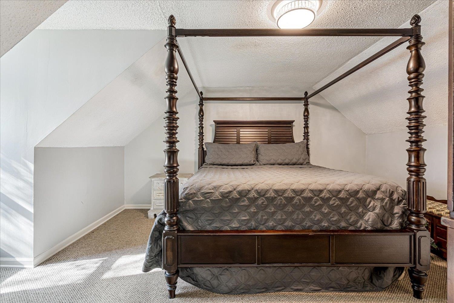 9516 El Hill Road Lakeland, TN 38002 - Photo 19 of 25 a bedroom with a bed and a ceiling fan