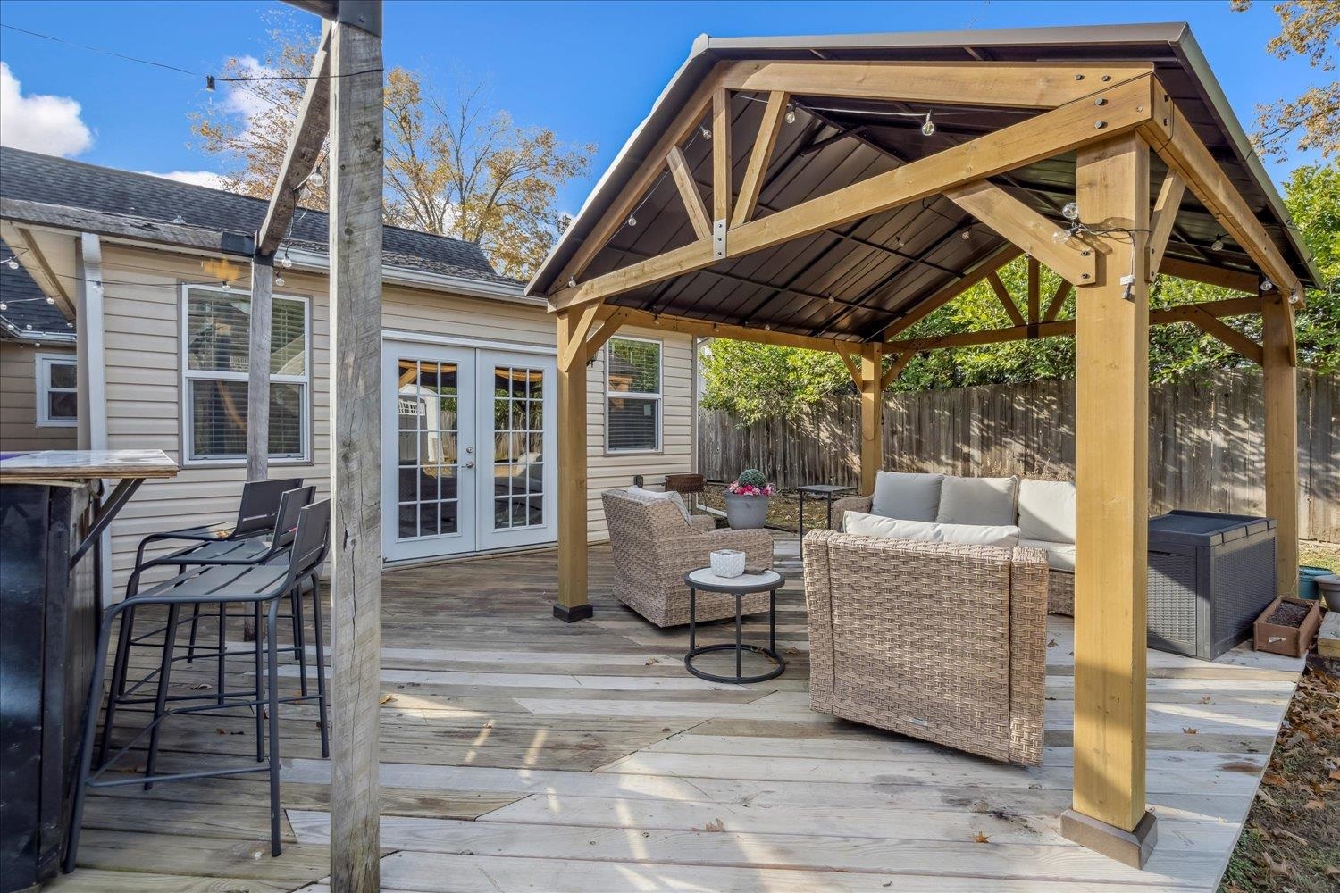 9516 El Hill Road Lakeland, TN 38002 - Photo 23 of 25 a roof deck with table and chairs and potted plants