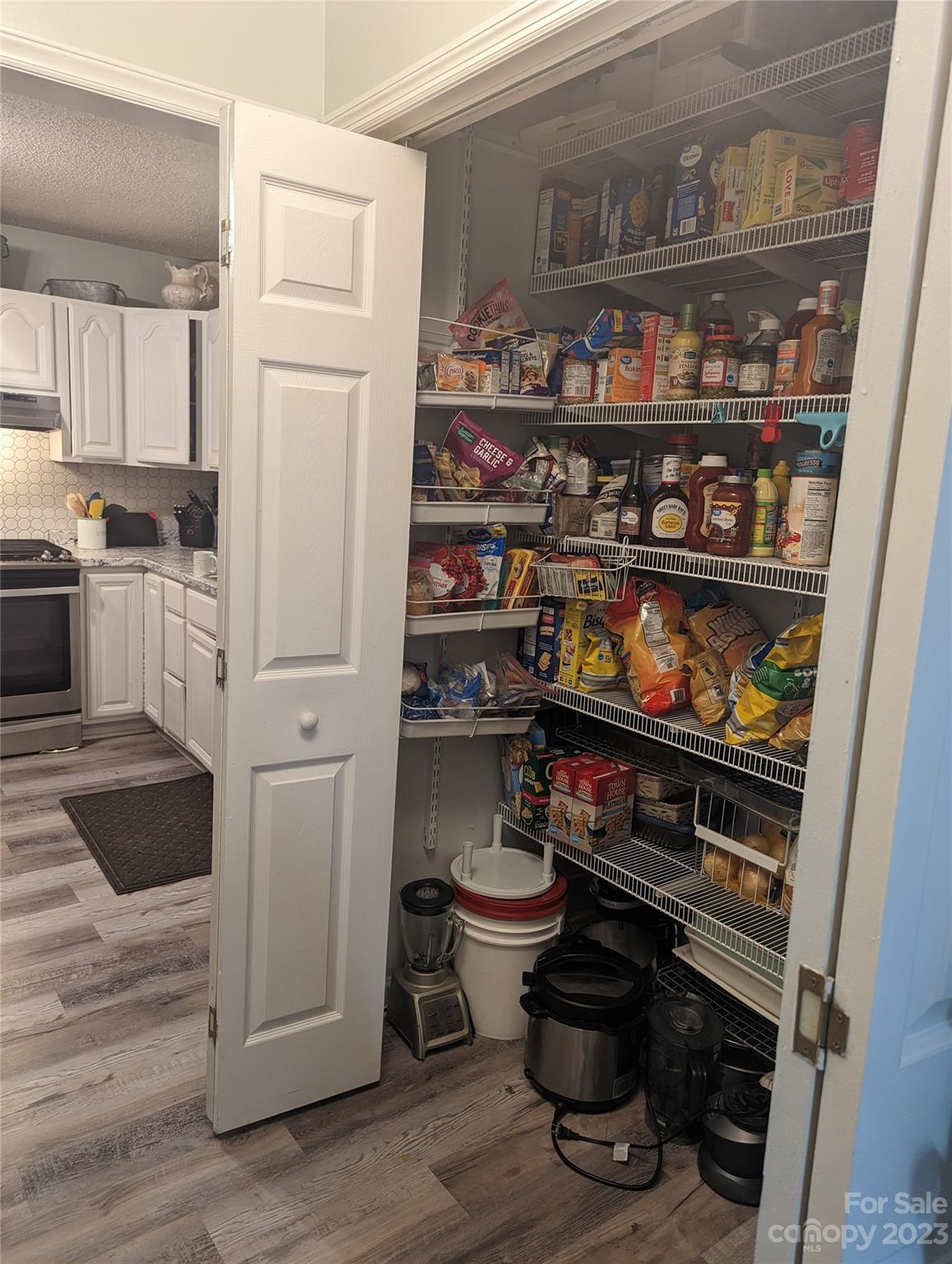 2059 Reece-Donahue Road Mount Croghan, SC 29727 - Photo 25 of 46 a kitchen with a lot of shelves and a refrigerator