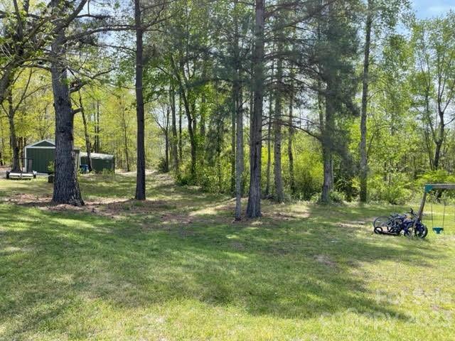 2059 Reece-Donahue Road Mount Croghan, SC 29727 - Photo 33 of 46 a backyard of a house with lots of green space and fountain