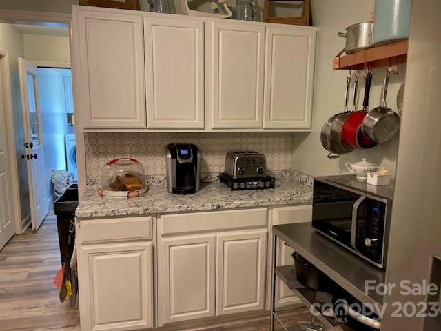 2059 Reece-Donahue Road Mount Croghan, SC 29727 - Photo 4 of 46 a kitchen with white cabinets and a stove