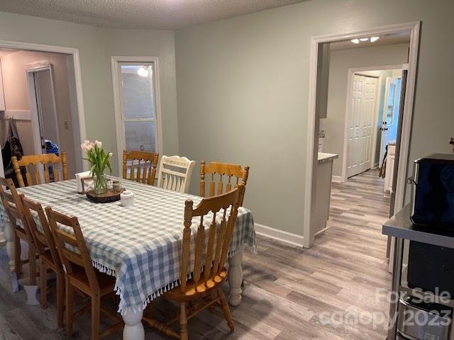 2059 Reece-Donahue Road Mount Croghan, SC 29727 - Photo 6 of 46 a view of a dining room with furniture and wooden floor