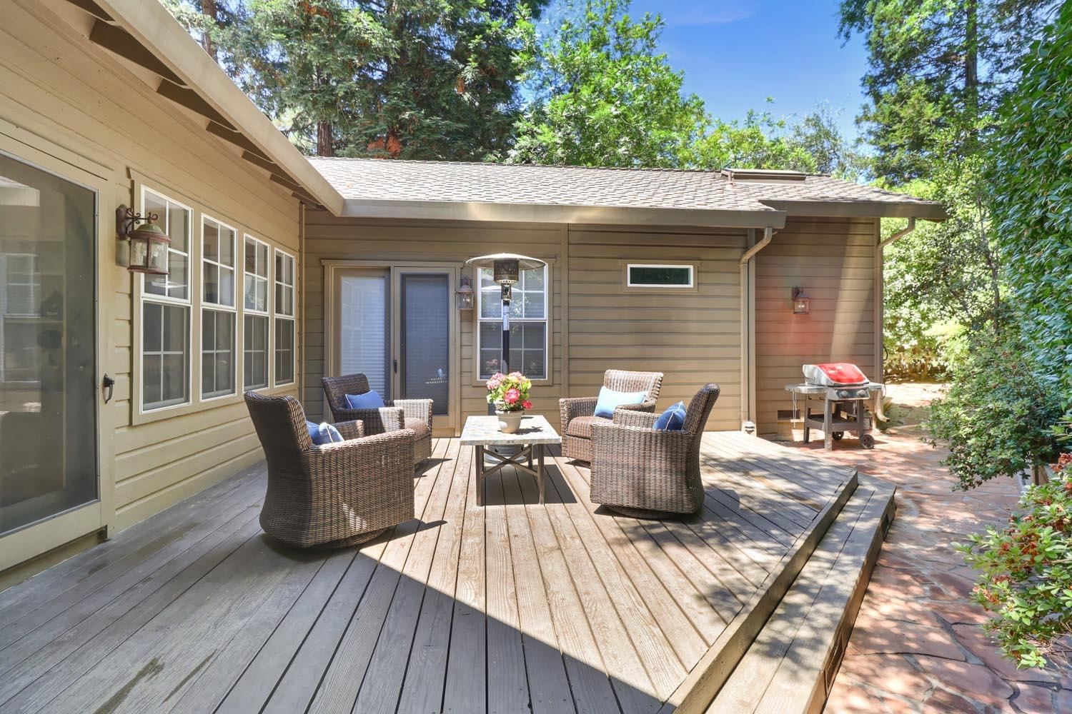 51 Covered Bridge Road Carmichael, CA 95608 - Photo 38 of 86 a view of a patio with table and chairs and wooden floor