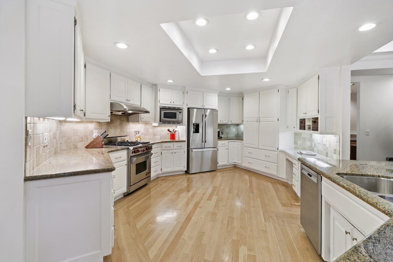 51 Covered Bridge Road Carmichael, CA 95608 - Photo 40 of 86 a kitchen with granite countertop a sink cabinets and stainless steel appliances