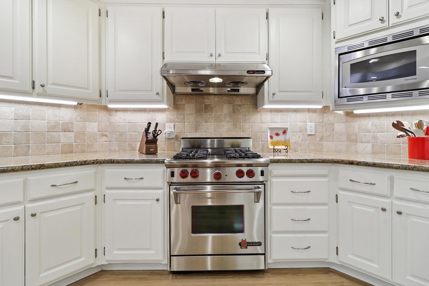51 Covered Bridge Road Carmichael, CA 95608 - Photo 43 of 86 a stove top oven sitting inside of a kitchen