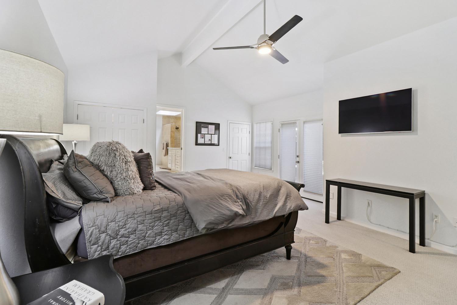 51 Covered Bridge Road Carmichael, CA 95608 - Photo 49 of 86 a bedroom with a large bed and a flat screen tv