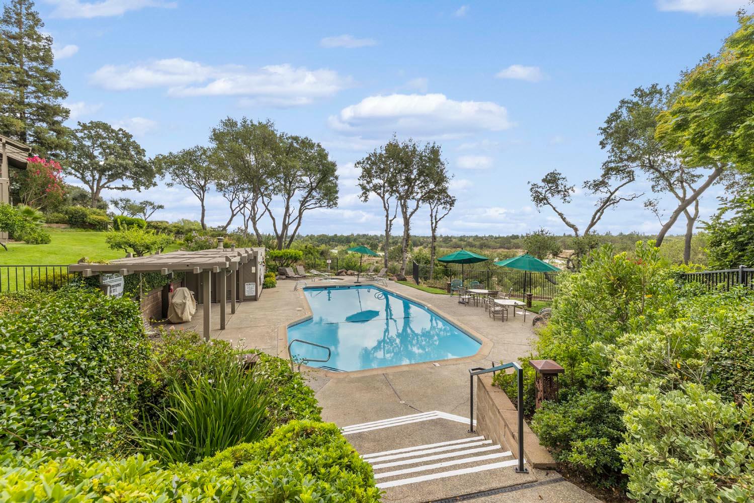51 Covered Bridge Road Carmichael, CA 95608 - Photo 7 of 86 a view of a swimming pool with a patio