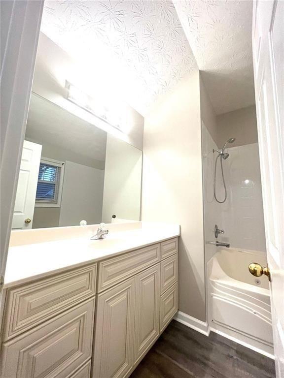 3854 Austin Park Lane Decatur, GA 30032 - Photo 26 of 44 a bathroom with a tub sink and mirror
