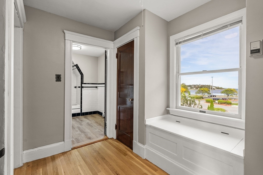18 Hummock Road Quincy, MA 02171 - Photo 18 of 37 a view of hallway with a large window and wooden floor