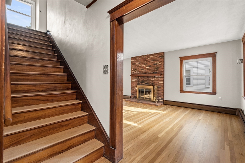 18 Hummock Road Quincy, MA 02171 - Photo 4 of 37 a view of an entryway with wooden floor and stairs