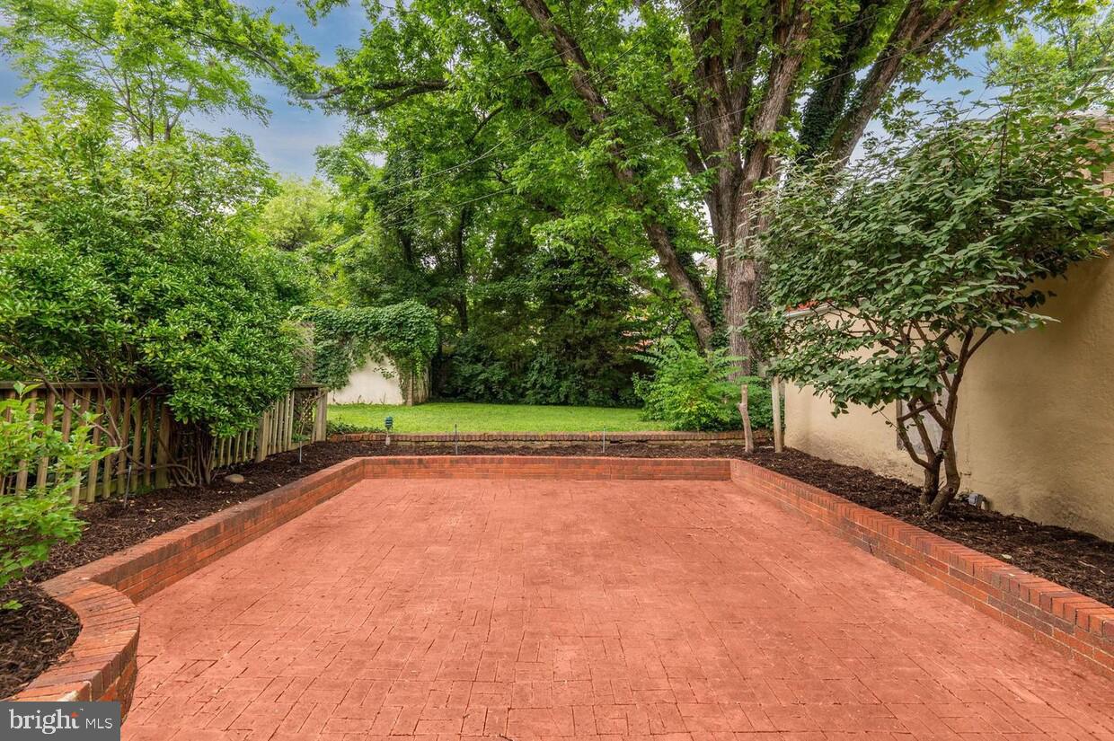 3403 Woodley Road Northwest Washington, DC 20016 - Photo 13 of 17 Back yard patio (lot line ends at the wall