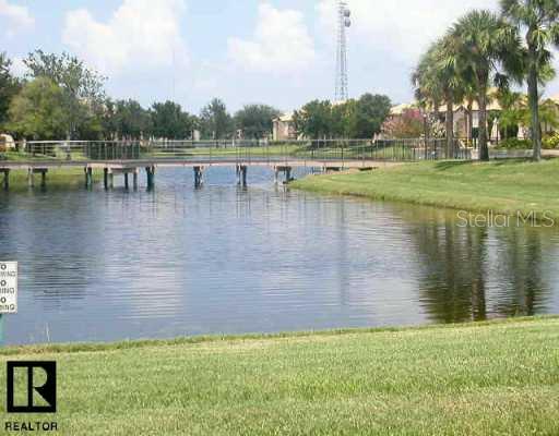 10263 Gandy Boulevard North, Unit 1508 St. Petersburg, FL 33702 - Photo 1 of 1 a view of a lake with outdoor space