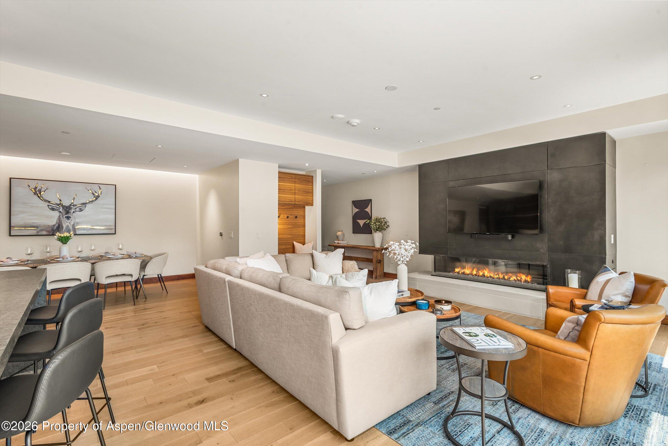 77 Wood Road, Unit 404 EAST Snowmass Village, CO 81615 - Photo 2 of 27 Living Room with Ortal Fireplace