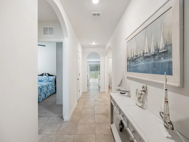 a bathroom with a bathtub sink and mirror