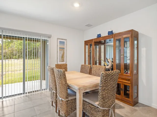 a balcony with table and chairs