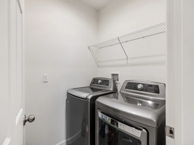 a view of swimming pool with seating area and barbeque vanity
