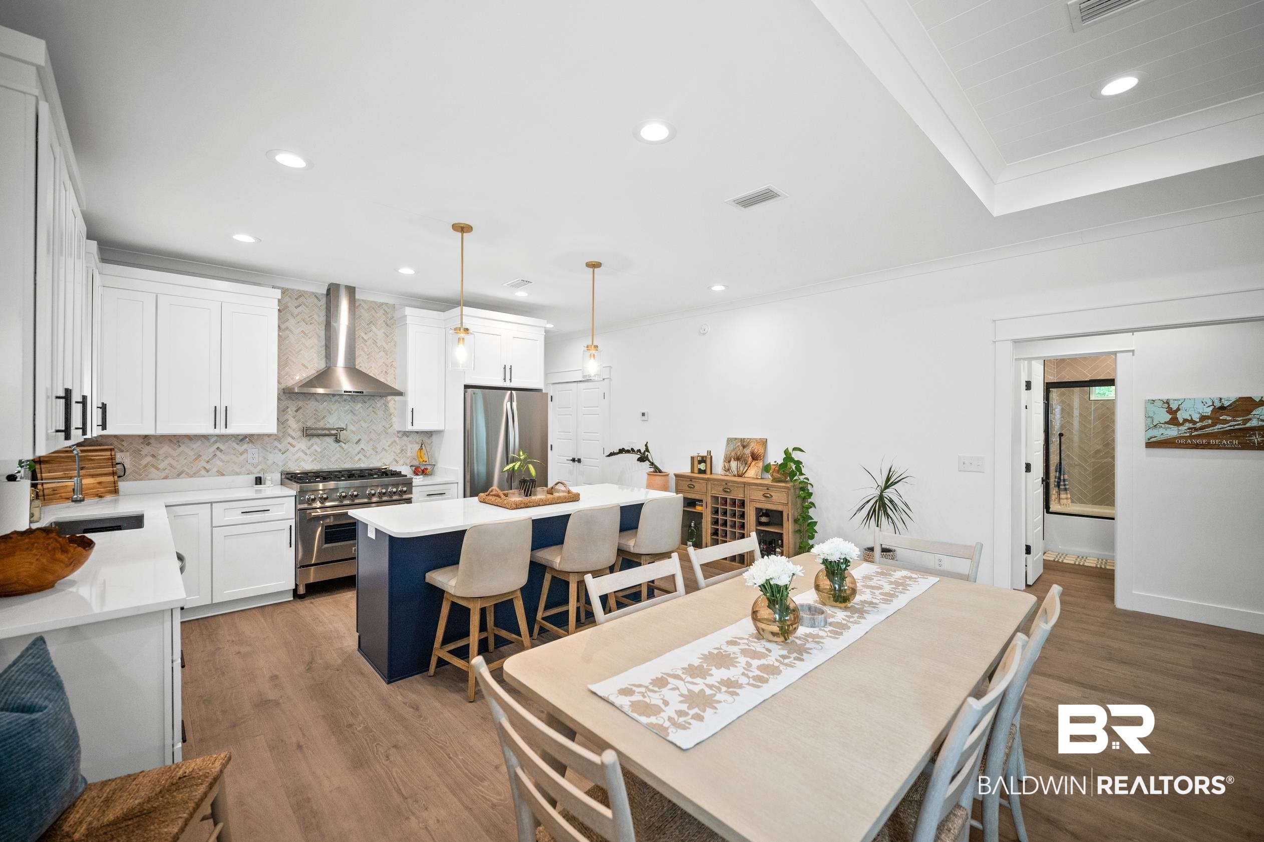 5501 Mobile Avenue Orange Beach, AL 36561 - Photo 7 of 40 Dining space featuring light wood-style flooring, recessed lighting, crown molding, and plenty of natural light