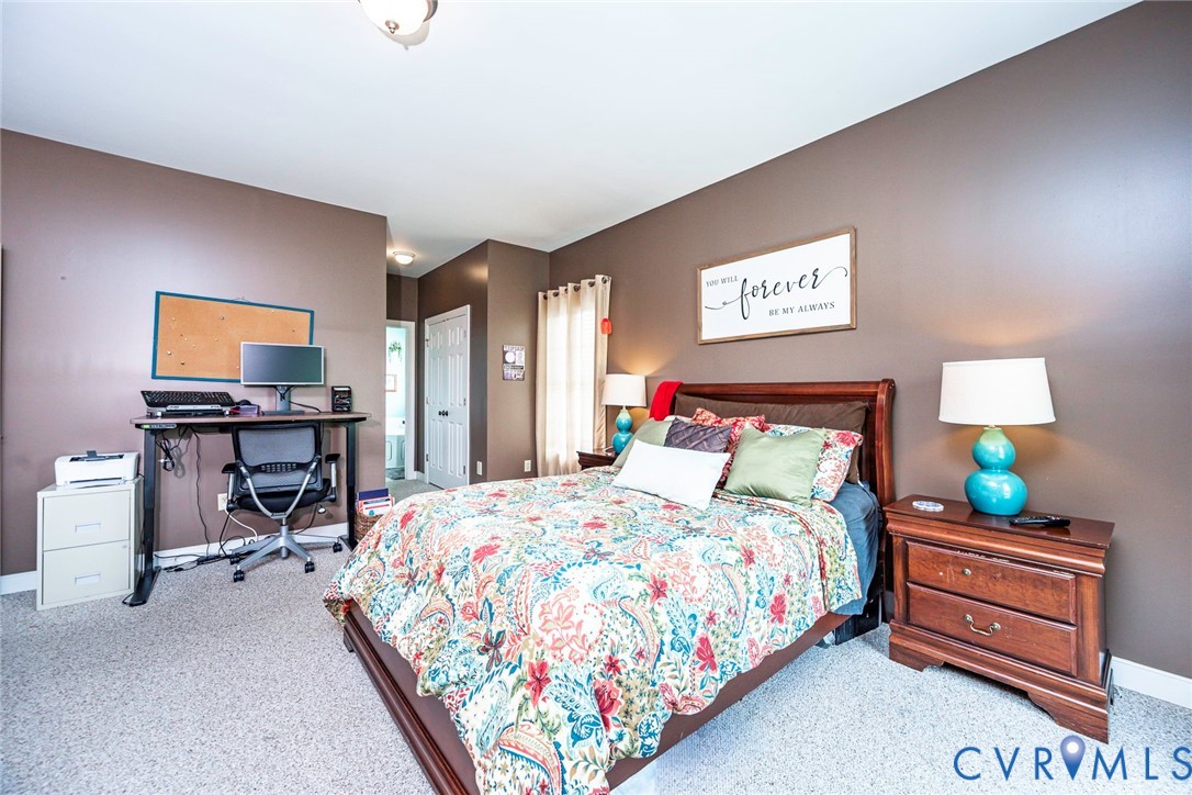 827 Sutherland Road Church Road, VA 23833 - Photo 19 of 51 Carpeted bedroom with a dark brown accent wall