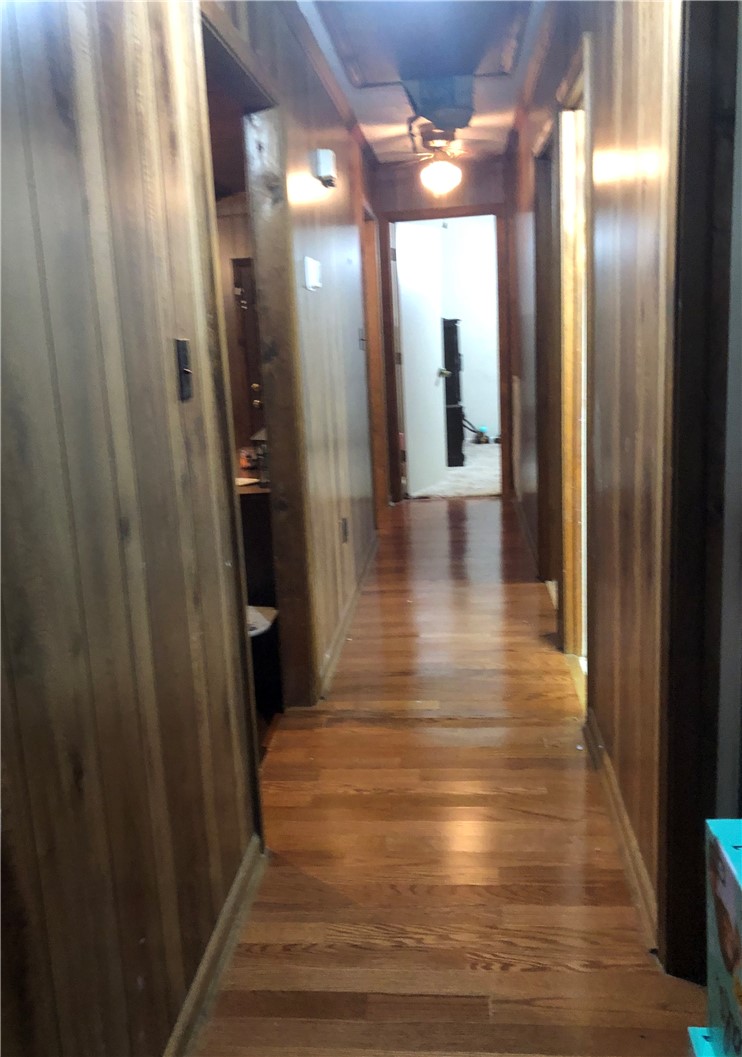 101 Victorian Drive Anderson, SC 29625 - Photo 19 of 26 This interior hallway features classic wood paneling and gleaming hardwood floors.