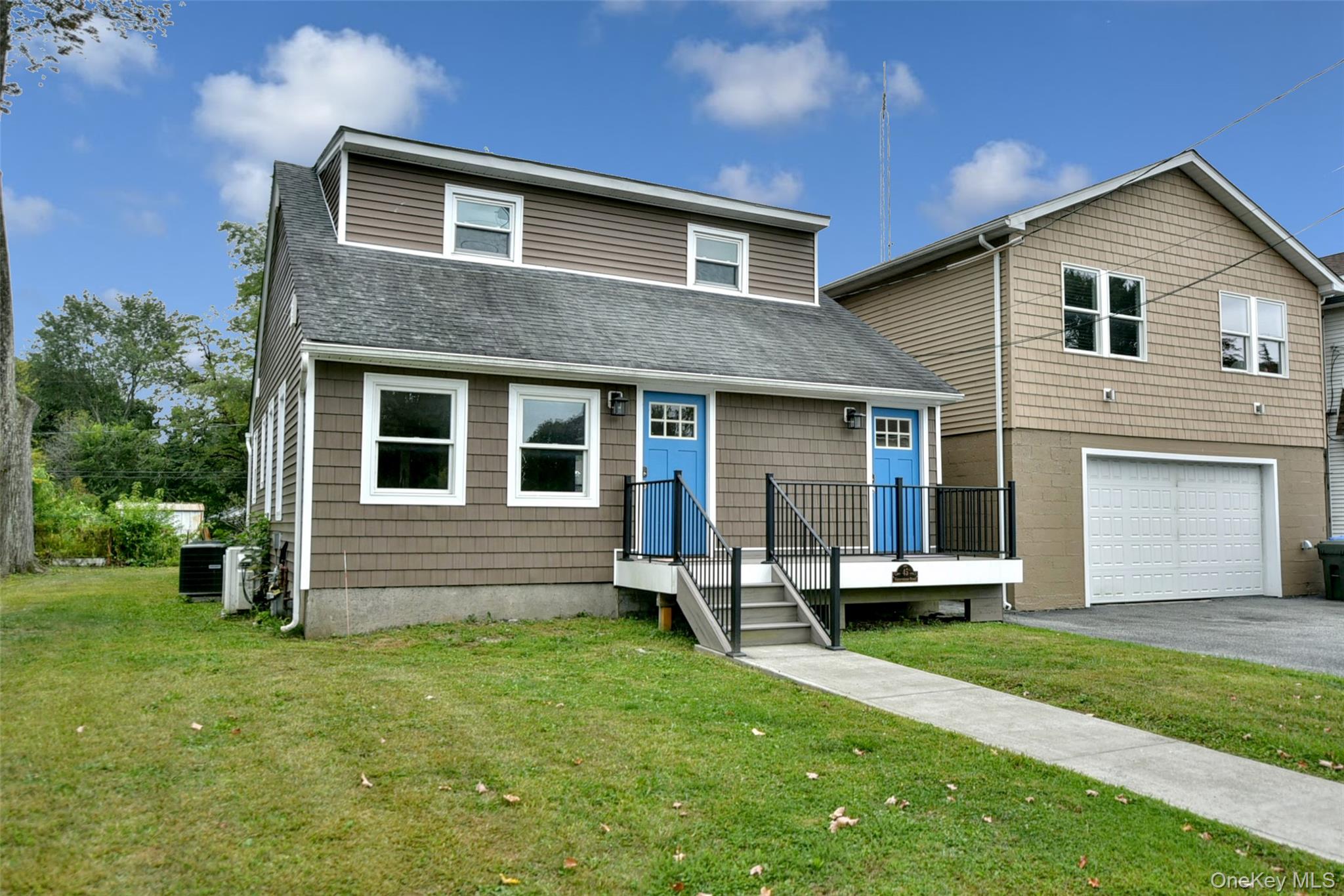 45 Waterstone Road Greenwood Lake, NY 10925 - Photo 1 of 1 a front view of a house with a garden