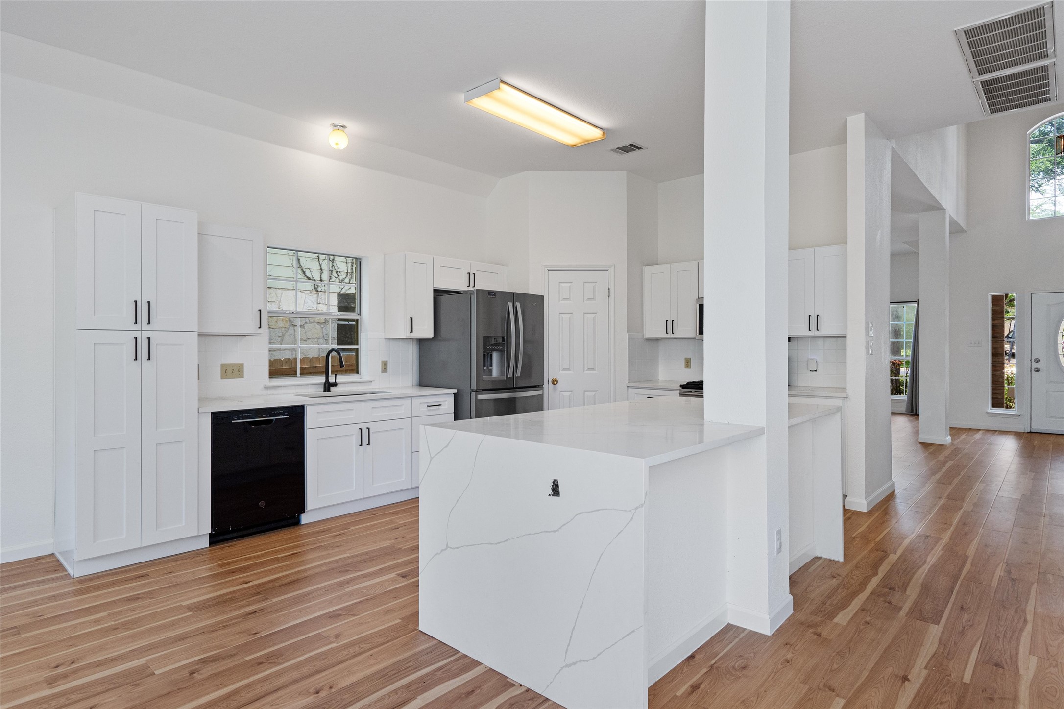 100 Parque Circle Georgetown, TX 78626 - Photo 13 of 39 a kitchen with white cabinets and stainless steel appliances