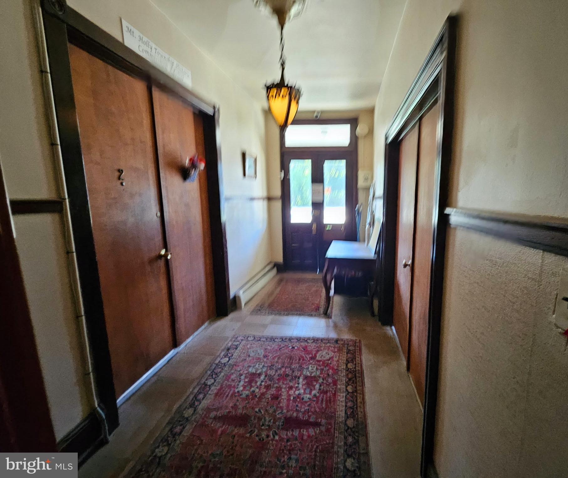 11 Washington Street Mount Holly, NJ 08060 - Photo 2 of 19 a bedroom with a bed and a window