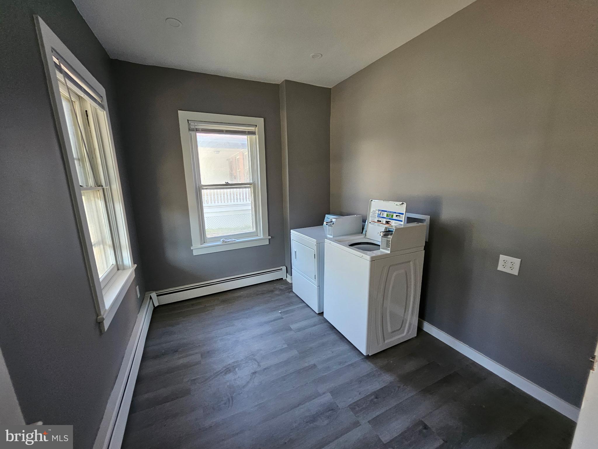 11 Washington Street Mount Holly, NJ 08060 - Photo 4 of 19 a view of an empty room with wooden floor and a window