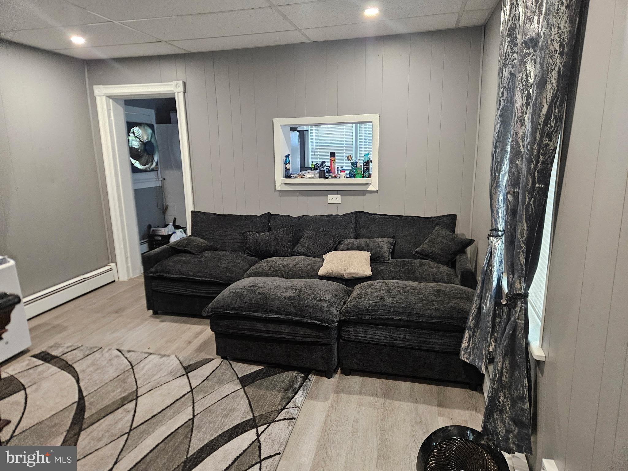 11 Washington Street Mount Holly, NJ 08060 - Photo 5 of 19 a living room with furniture and a window
