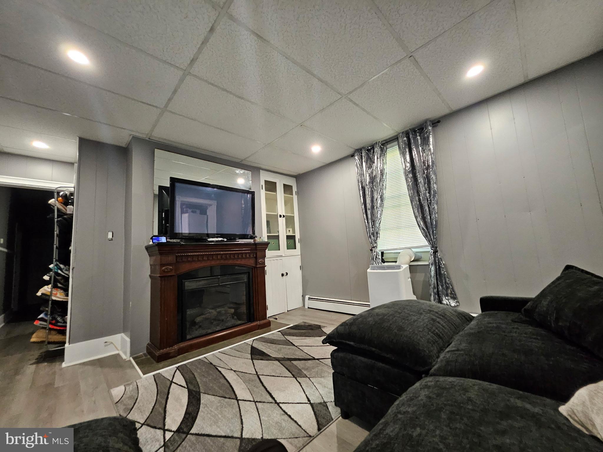 11 Washington Street Mount Holly, NJ 08060 - Photo 6 of 19 a living room with furniture and a flat screen tv