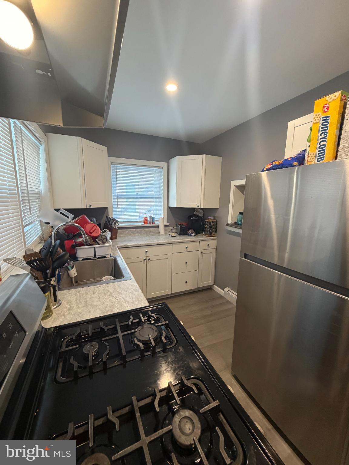 11 Washington Street Mount Holly, NJ 08060 - Photo 8 of 19 a kitchen with a stove and a refrigerator