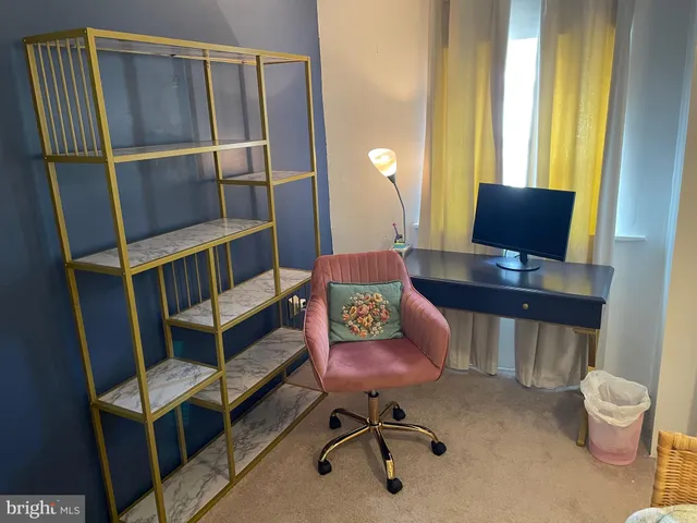 a workspace with furniture and a window